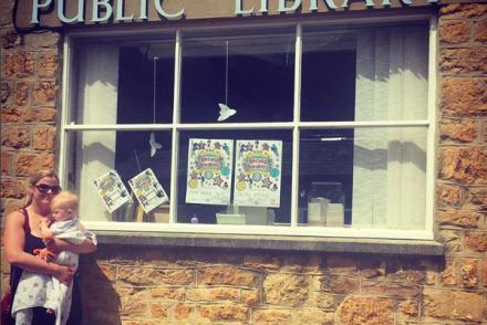Holly Seddon and baby outside a library